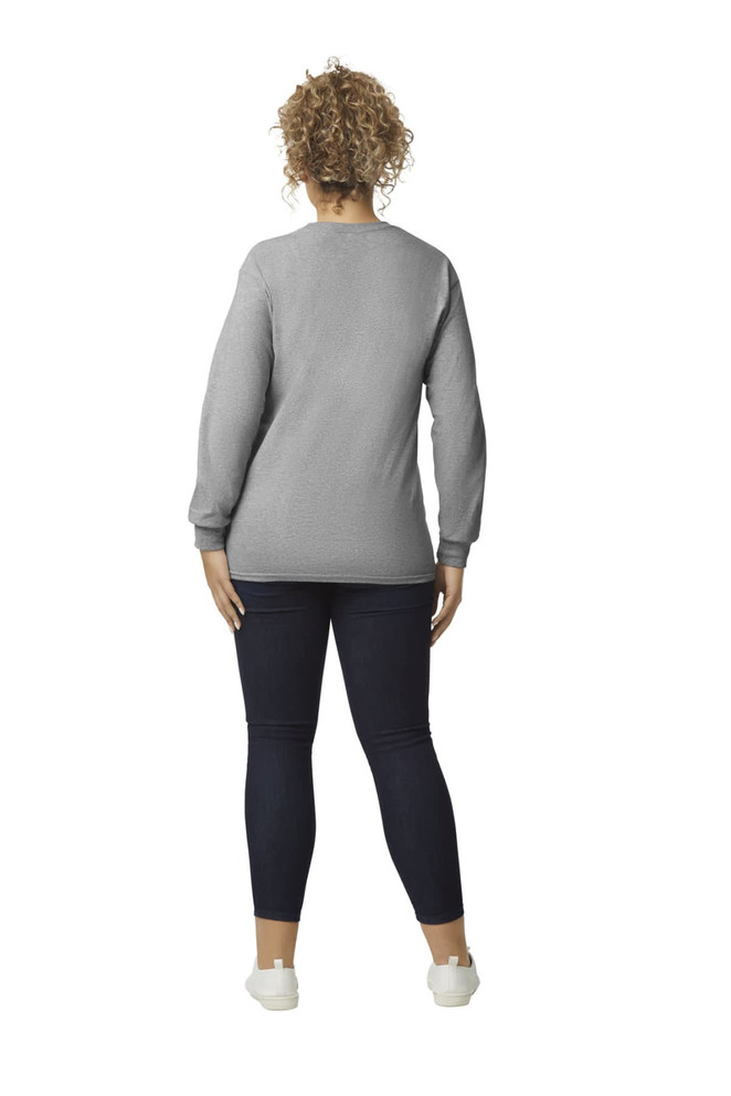 A woman wearing a grey Gildan Ultra Cotton adult long sleeve t-shirt, viewed from the back, paired with navy leggings.