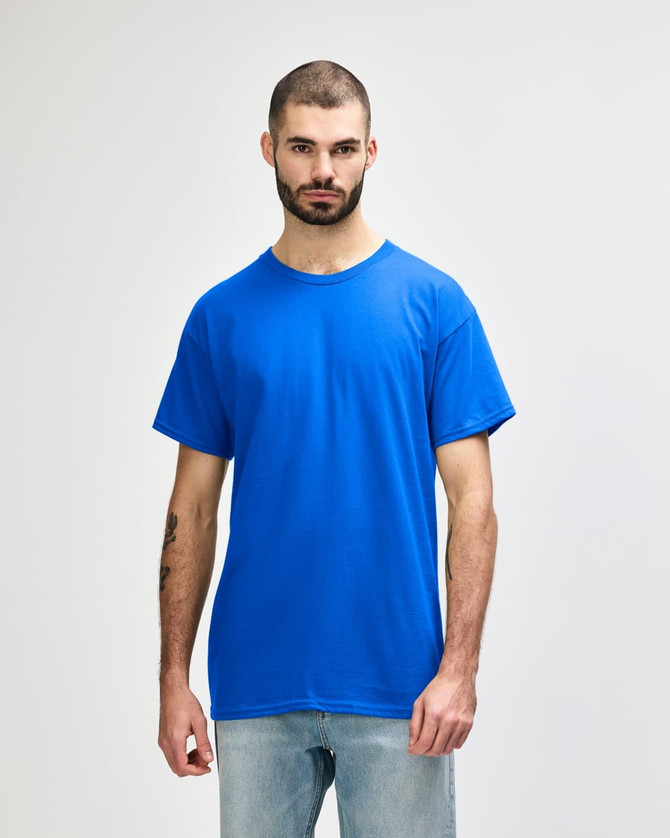 A blue Gildan Heavy Cotton Adult T-Shirt on a male model, featuring short sleeves and a relaxed fit.