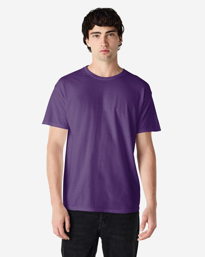 A purple Gildan Heavy Cotton Adult T-Shirt displayed on a model, featuring a plain design and a logo.