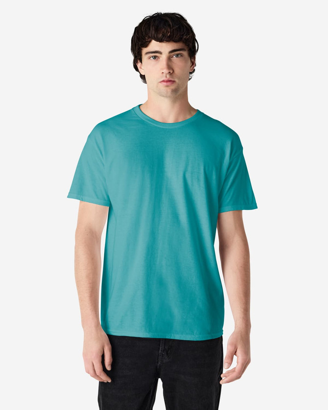 A turquoise Gildan Heavy Cotton adult T-shirt displayed on a model, featuring a round neck and short sleeves.