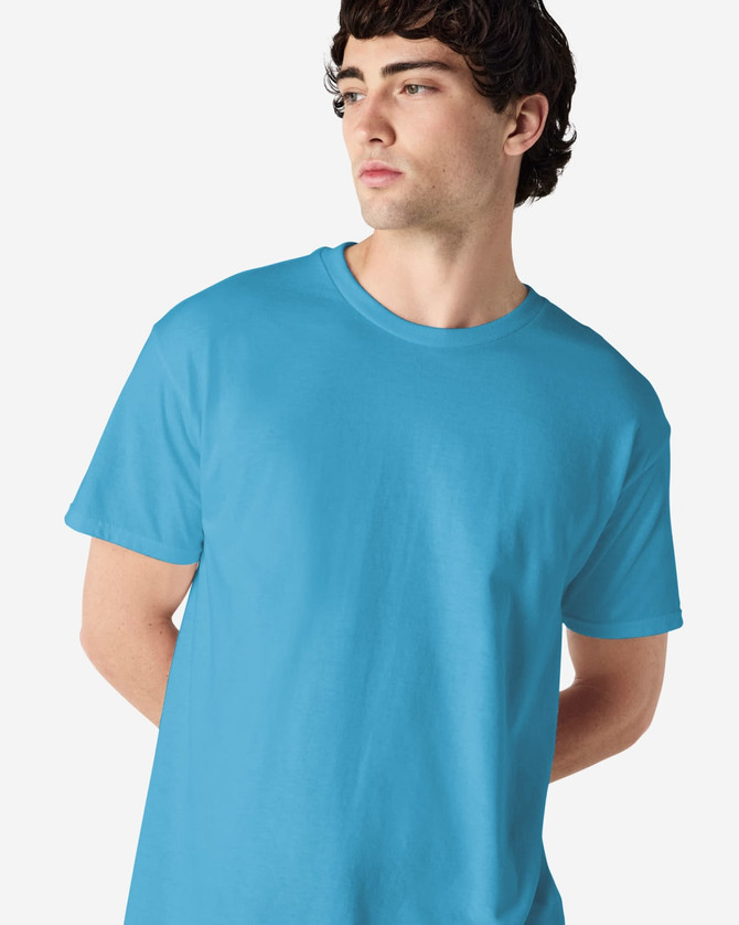 A plain turquoise adult t-shirt displayed on a model, featuring a simple design and a crew neck.