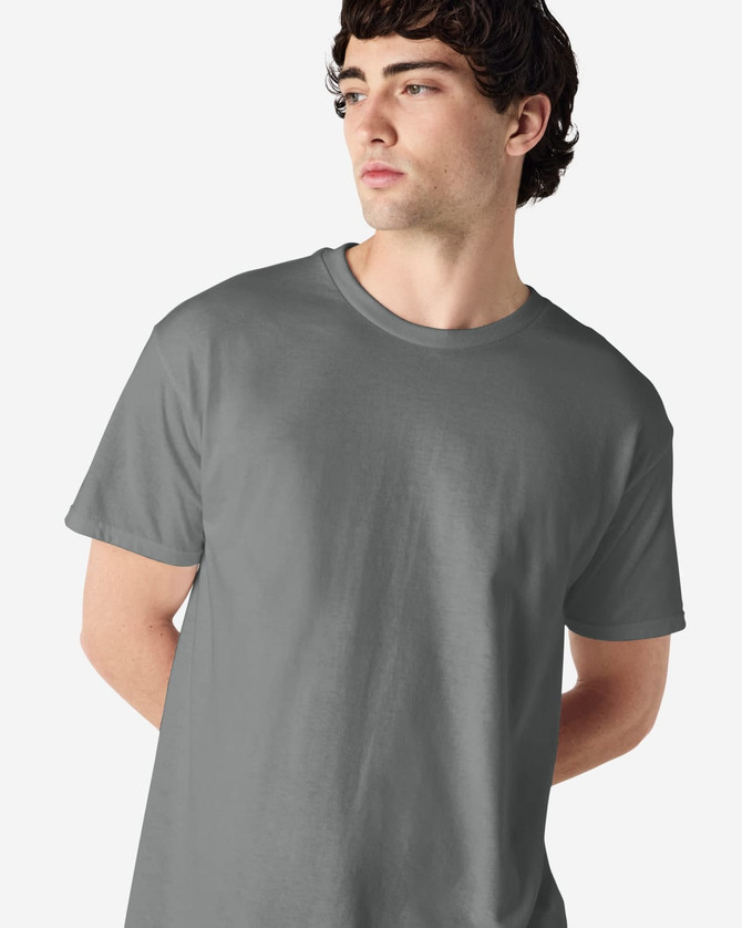 A grey Gildan Heavy Cotton adult T-shirt displayed on a male model with a neutral background.