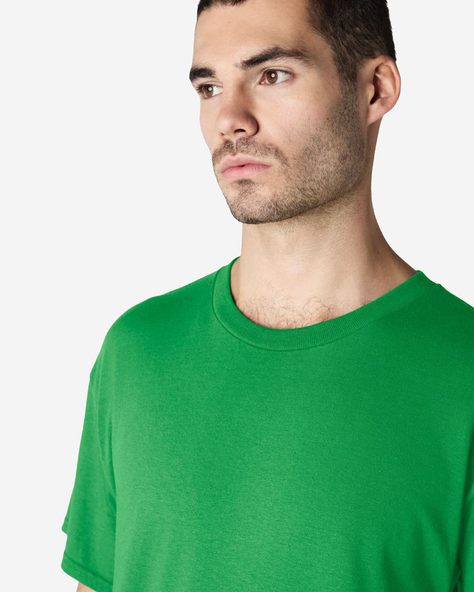 A green Gildan Heavy Cotton adult T-shirt displayed on a model. The shirt has a simple design and no visible logos.