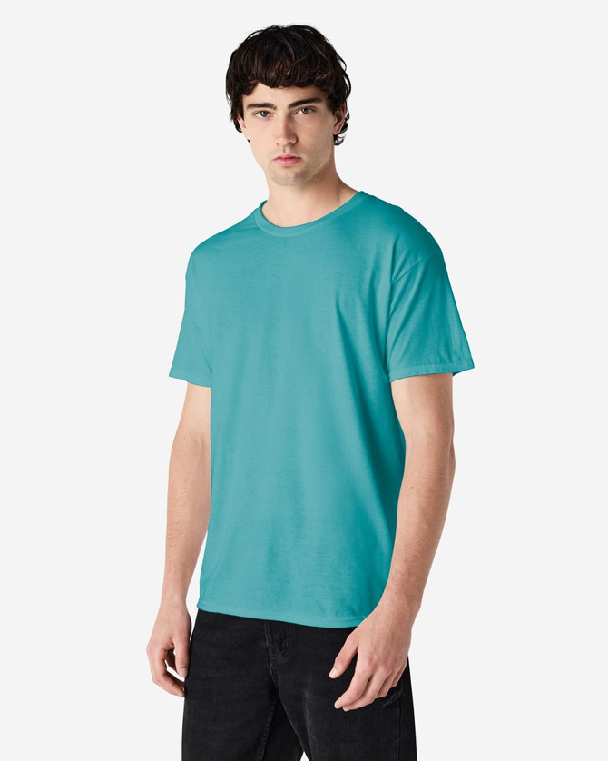 A turquoise Gildan Heavy Cotton Adult T-Shirt displayed on a male model, featuring a simple design and a logo.