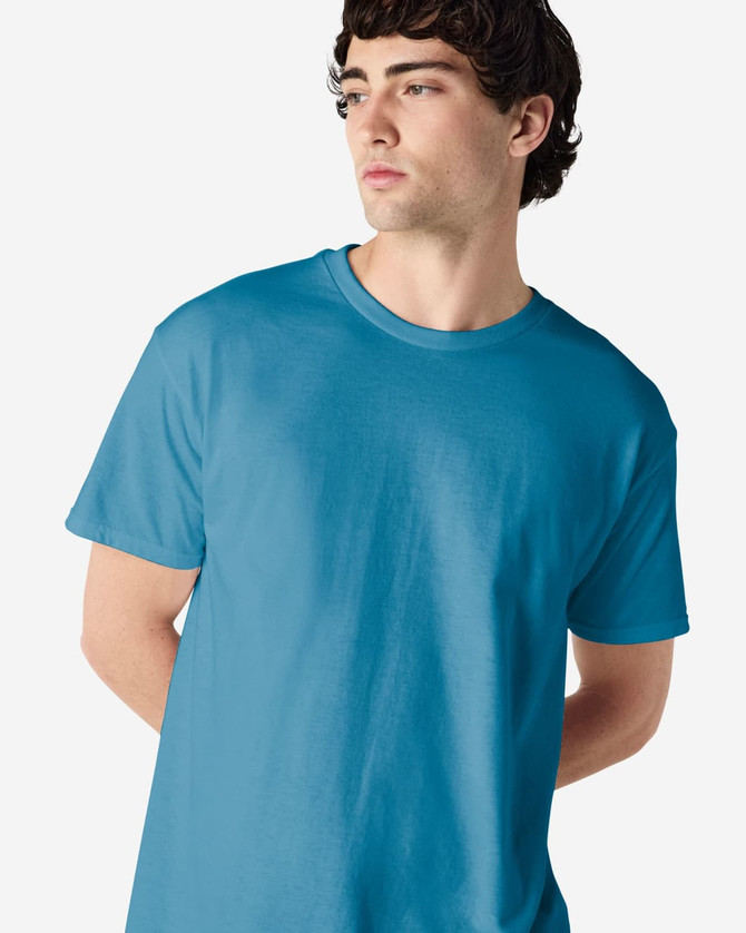 A blue Gildan Heavy Cotton adult t-shirt on a male model, featuring a plain design and a logo.