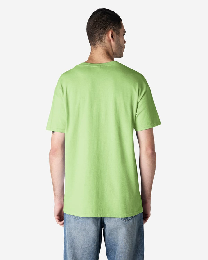 A man wearing a bright green Gildan Heavy Cotton Adult T-Shirt, viewed from the back. The shirt has a logo on it.
