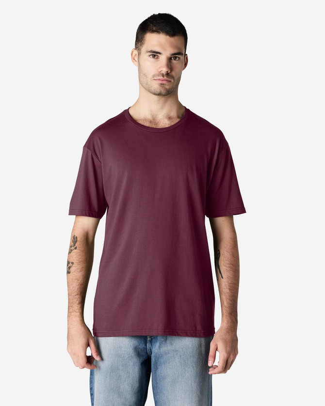 A maroon Gildan Softstyle adult t-shirt displayed on a male model against a neutral background. The shirt has a brand logo.