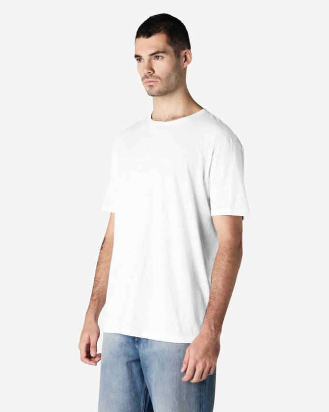 A white Gildan Softstyle adult t-shirt displayed on a model, with a simple design and soft fabric texture.
