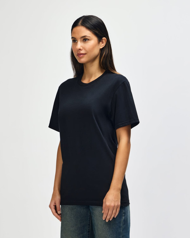 A black Gildan Softstyle adult t-shirt displayed on a model, featuring a simple design and short sleeves.