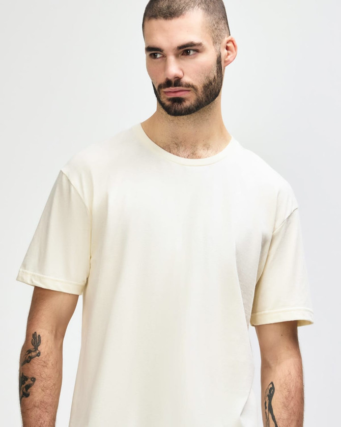 A white adult T-shirt featuring a relaxed fit, with a crew neckline and no visible logos.