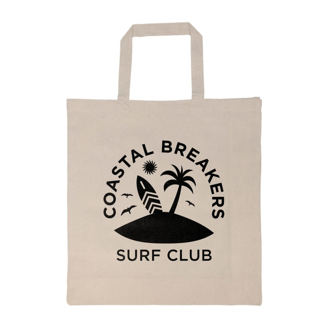 A cream-colored tote bag with a black logo featuring a palm tree, surfboard, and birds. It has short handles.