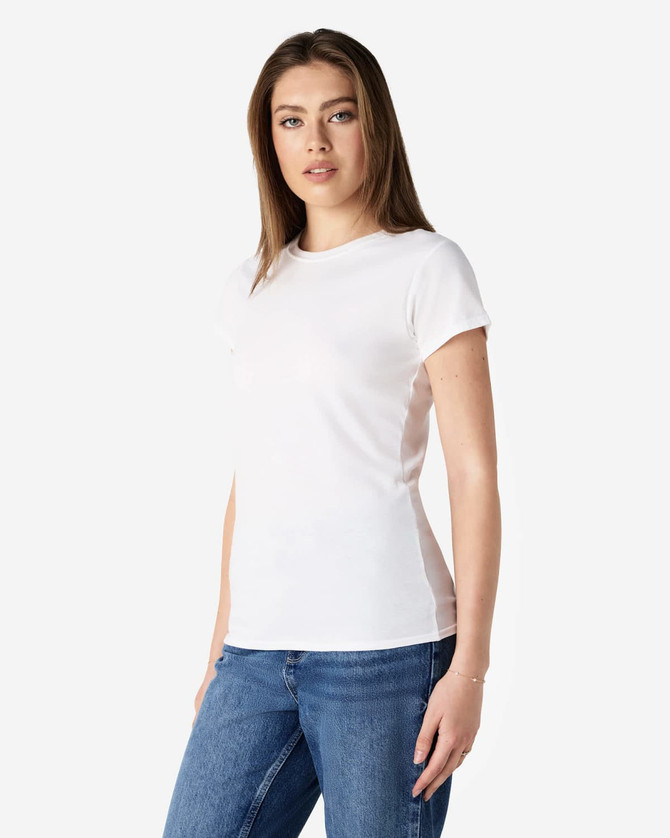 A fitted white ladies' T-shirt displayed on a model, paired with blue denim jeans. The shirt has a logo.