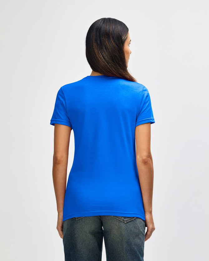 A blue ladies' t-shirt with a fitted design and a subtle brand logo on the back, paired with denim jeans.