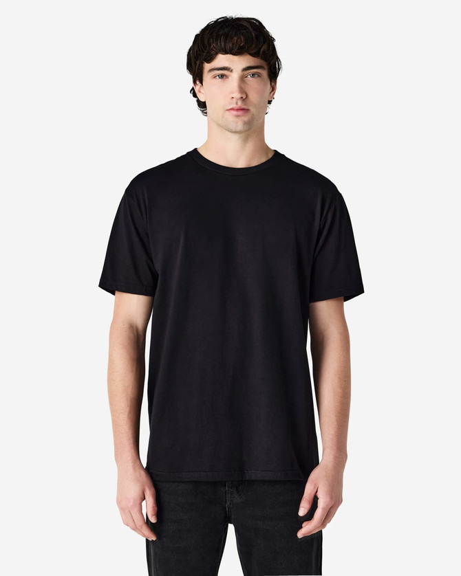 A black Gildan Softstyle adult midweight T-shirt displayed on a model, featuring a simple design and no visible logo.
