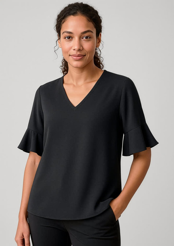 A black fluted sleeve blouse with a V-neckline, displayed on a model against a neutral background.