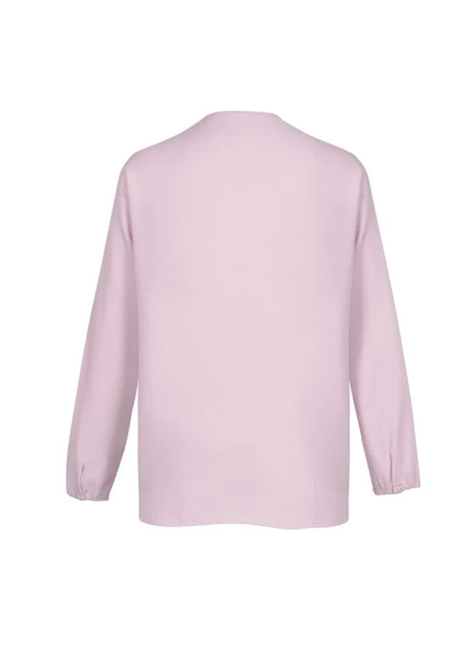 A light pink hi-lo blouse with long sleeves and a relaxed fit, featuring a simple design and a brand logo.