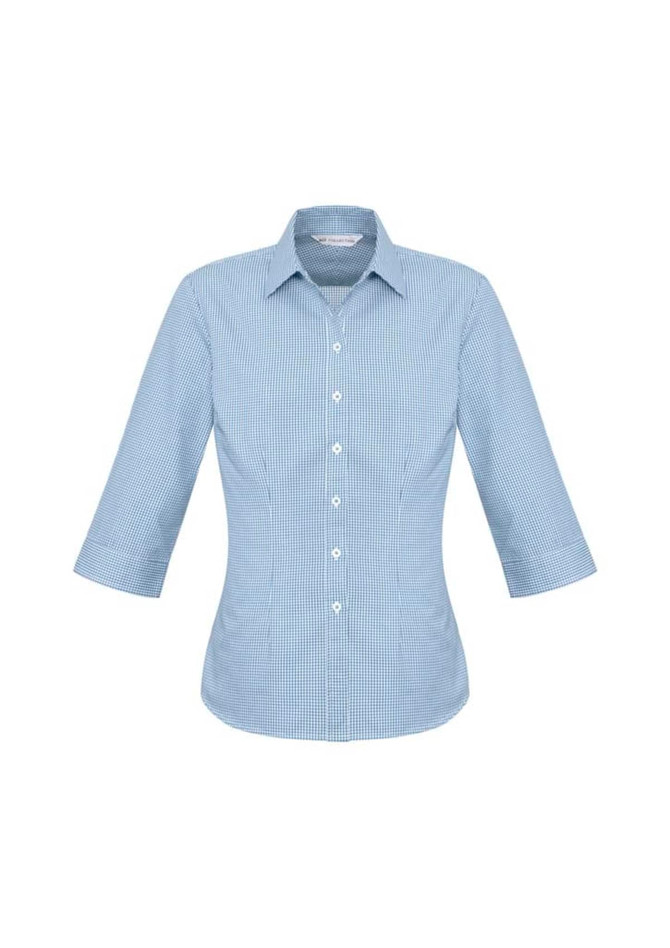 A women's 3/4 sleeve button-up shirt in a light blue check pattern, featuring a classic collar and a logo.