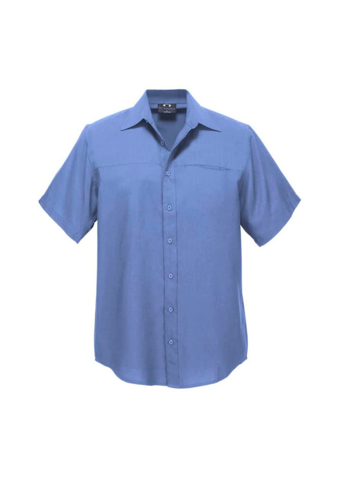 A plain short sleeve button-up shirt in a soft blue colour, featuring a logo on the chest.