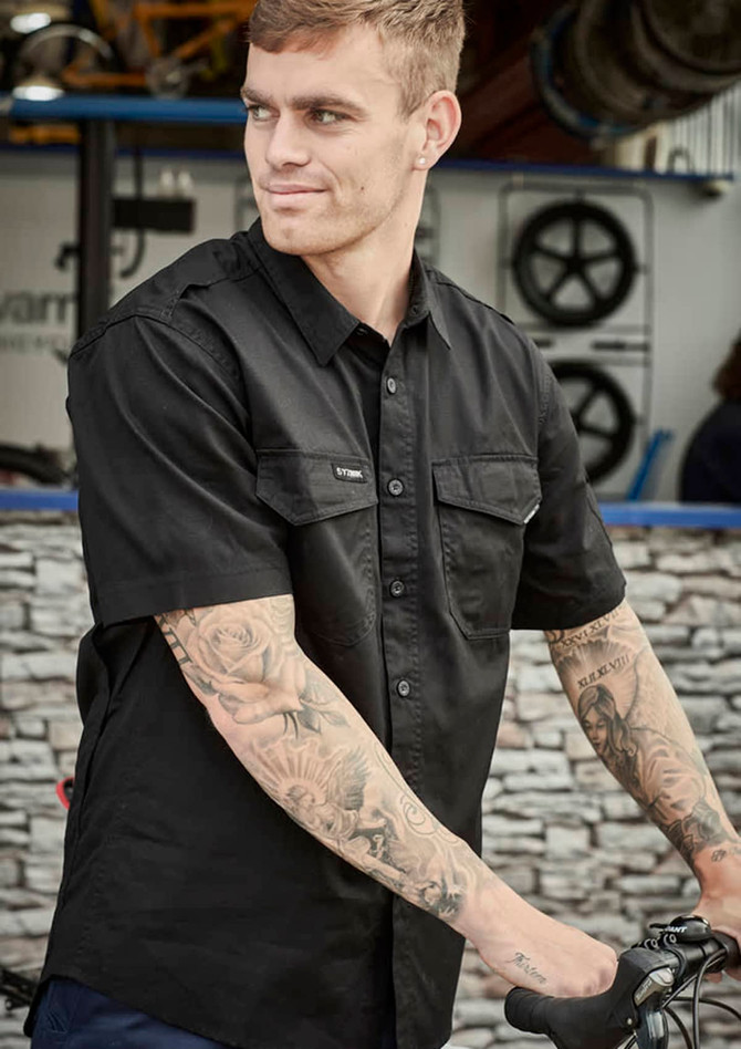 A black short-sleeve shirt with a button-up front, featuring two chest pockets and a logo.