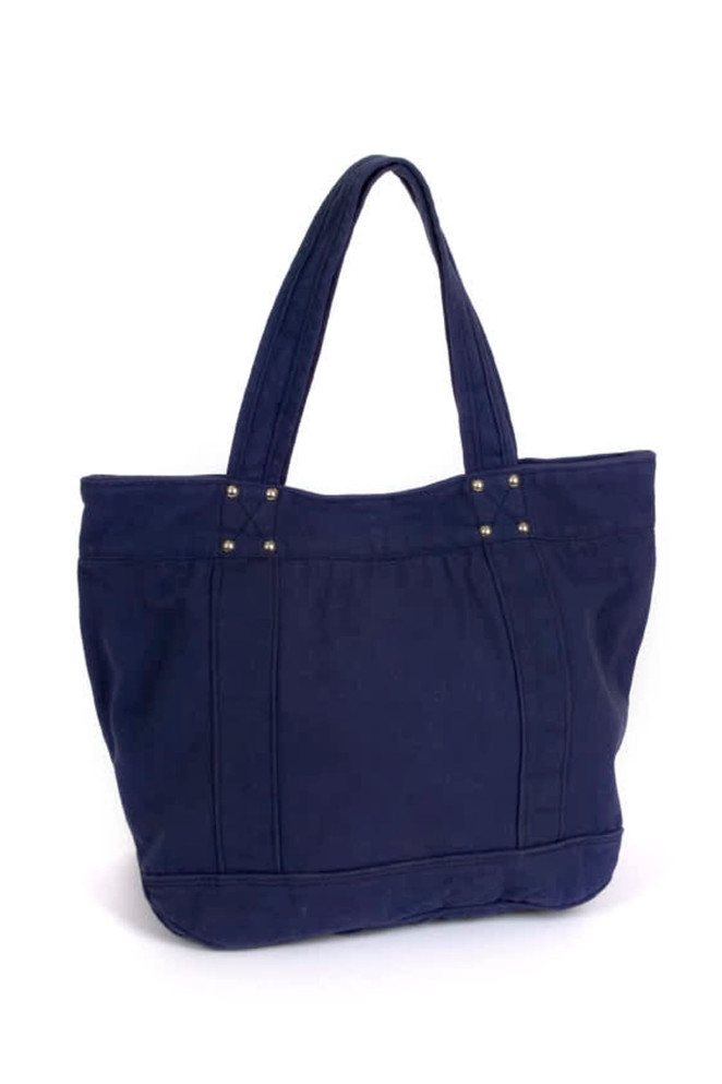 A large navy tote bag with two sturdy handles and decorative studs on the front. It features a simple, stylish design.