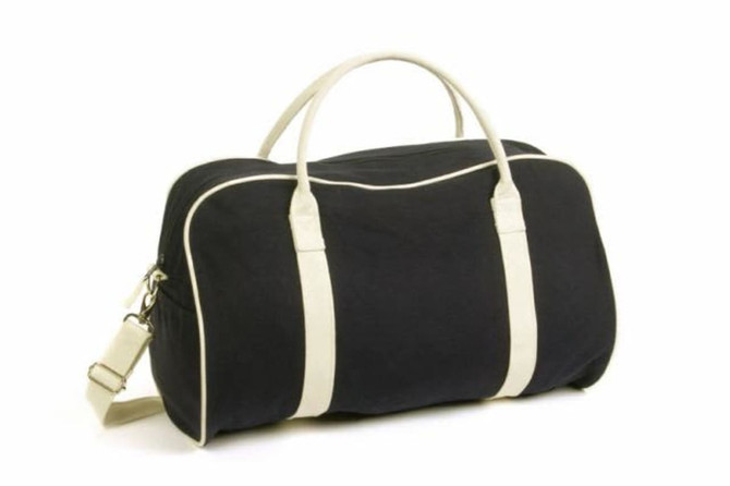 A black bag with cream accents, featuring handles and a shoulder strap, and a logo design.