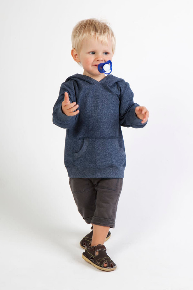 A blue heather hoodie on a toddler, paired with dark shorts and sandals, with a pacifier in their mouth.