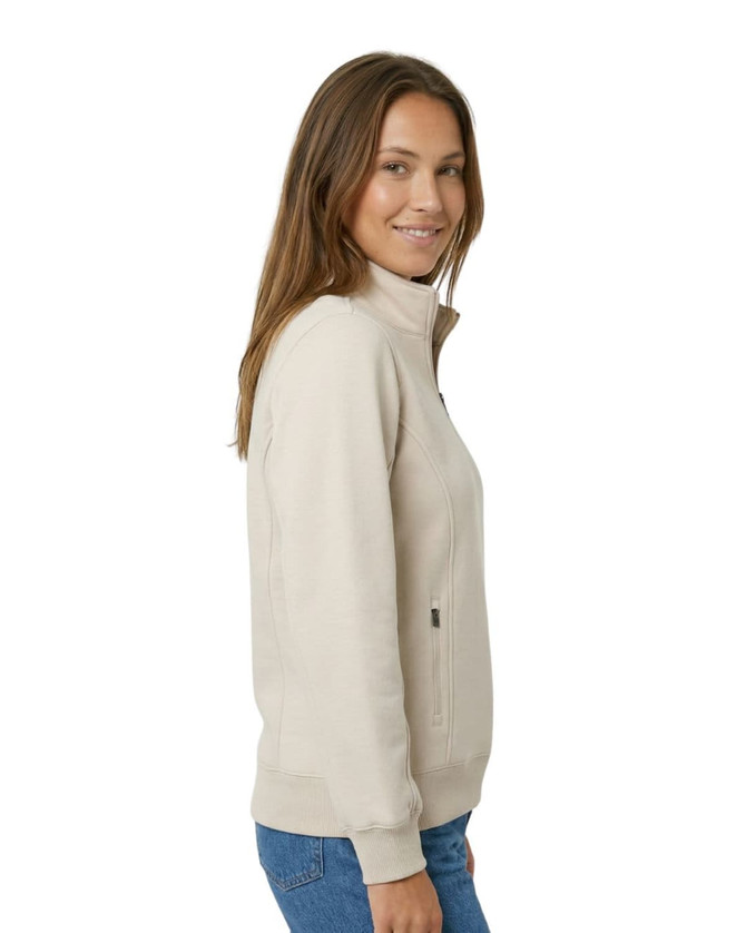 A women's half-zip fleece jumper in a beige colour, featuring a high collar and a subtle logo.