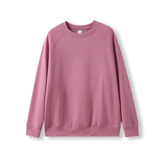 A pink sweatshirt with a classic crew neck and long sleeves, featuring a simple design and a logo.