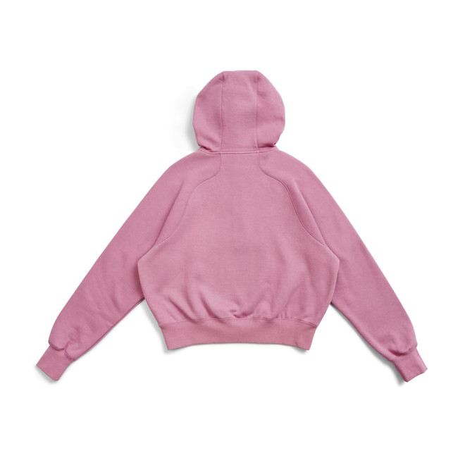 A pink cotton half-zip jumper with a hood and ribbed cuffs, featuring a logo on the back.