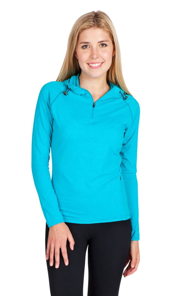 A bright turquoise women's half-hood top with a zippered neck and long sleeves, featuring a logo.
