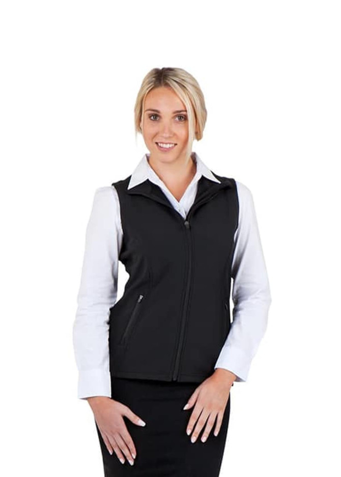 A black women's soft shell vest from the TEMPEST range, featuring a zip front and styled with a white shirt.