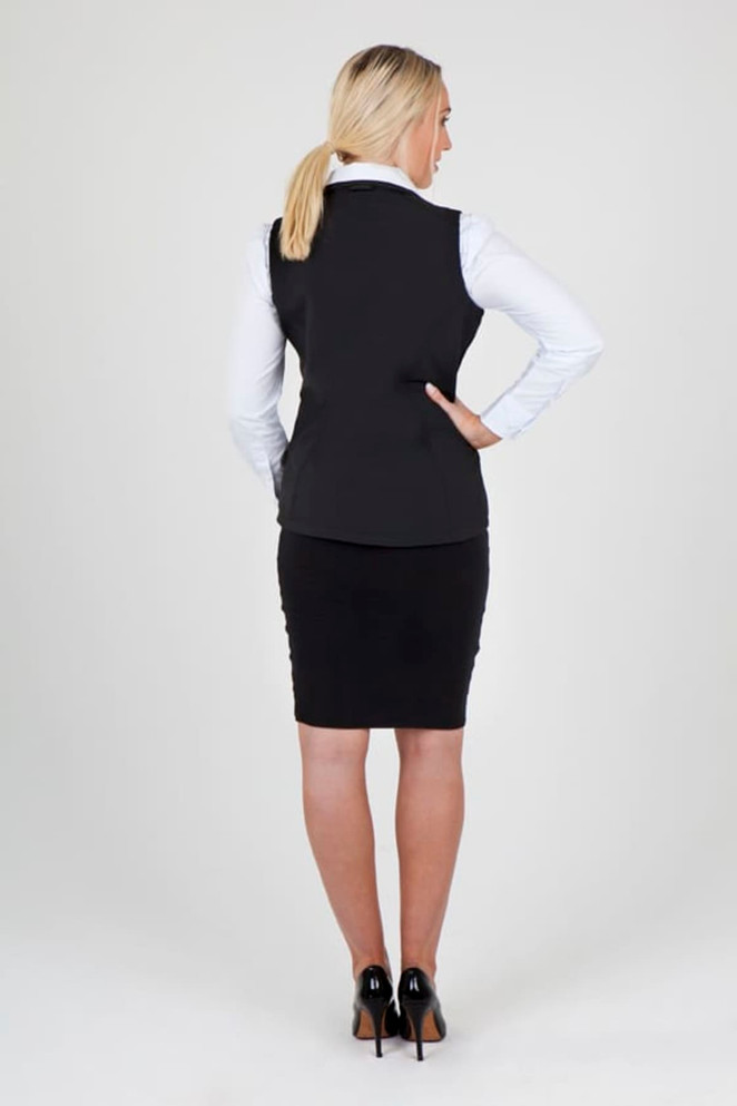 A black women's soft shell vest, featuring a fitted design, shown from the back, paired with a pencil skirt.