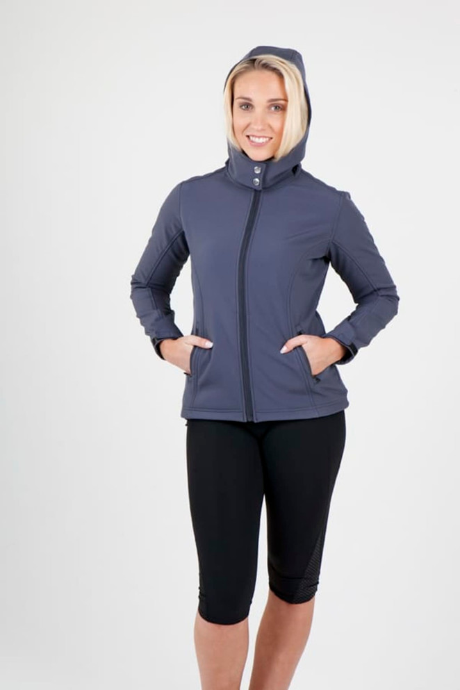 A model wearing a women's soft shell hooded jacket in grey, featuring a hood and two front pockets.