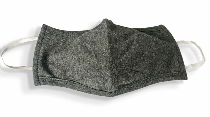 A grey 100% cotton face mask with ear loops, featuring a structured design and a simple logo.