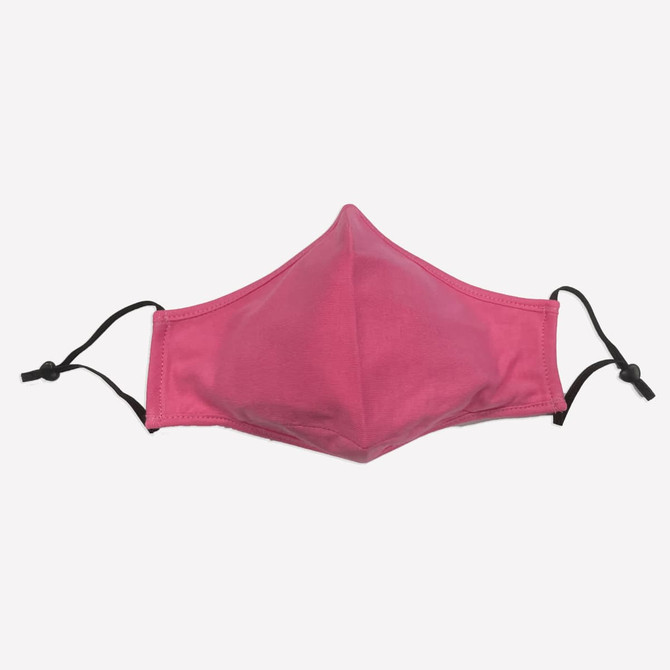 A pink face mask made of 100% cotton with adjustable toggles for a secure fit.