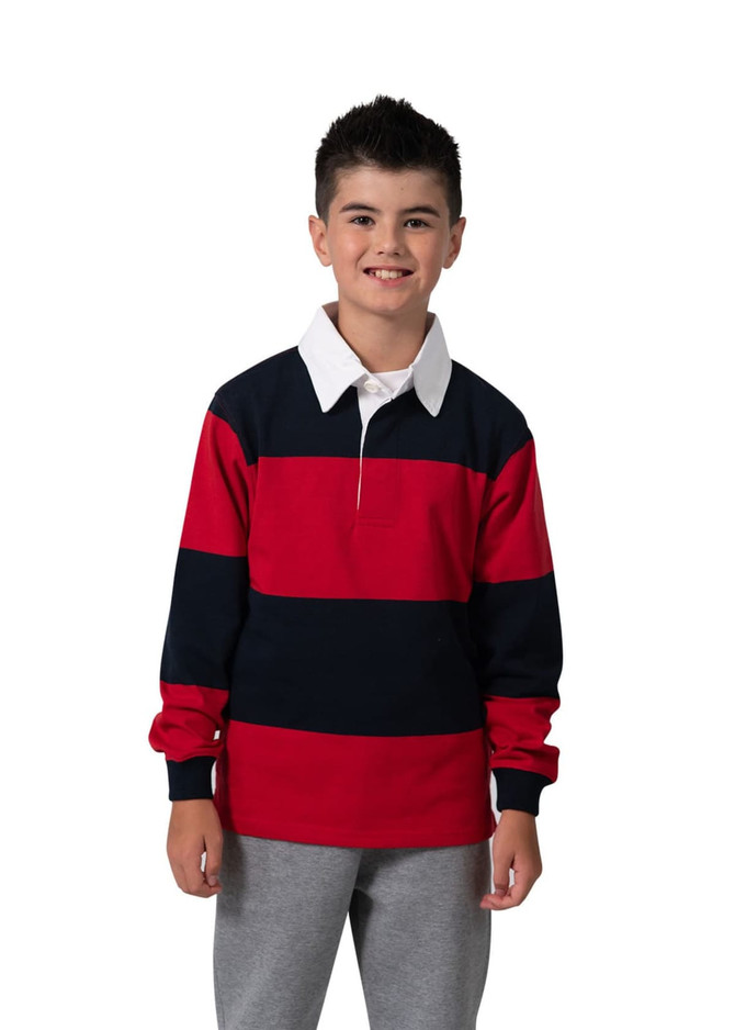 A kid wearing a red and navy striped rugby polo top with a white collar, paired with grey pants. The shirt has a logo.