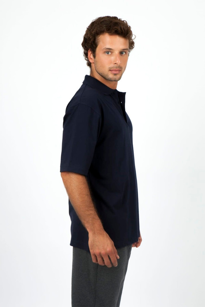 A navy blue men's 100% cotton jersey polo shirt displayed on a model, featuring a collar and short sleeves.