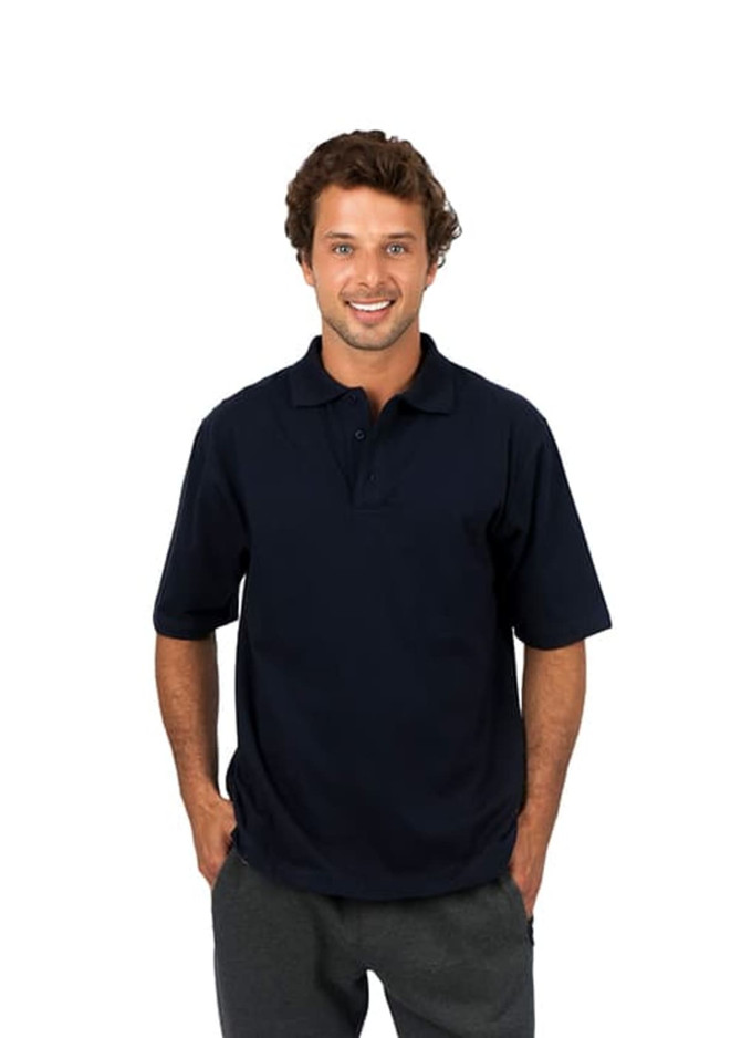 A man wearing a navy blue polo shirt made of 100% cotton jersey, with a logo on the chest.