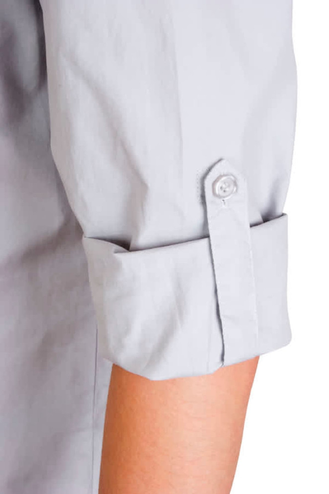 A grey women's military long sleeve shirt featuring rolled-up sleeves and button details.