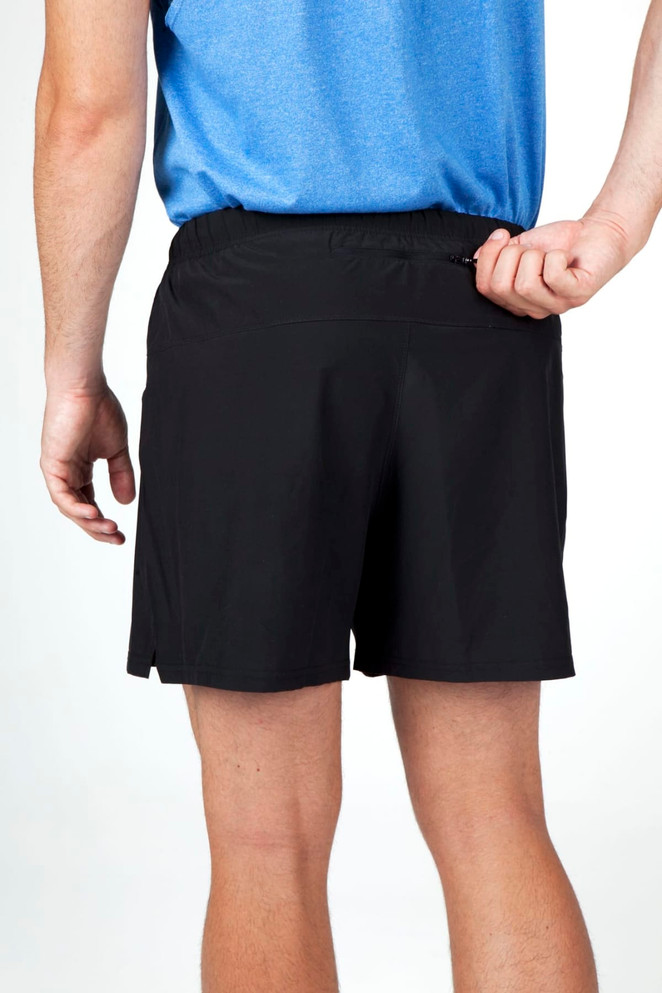 Men's FLEX shorts in black with a sleek design and a zip pocket at the back. Features four-way stretch material.