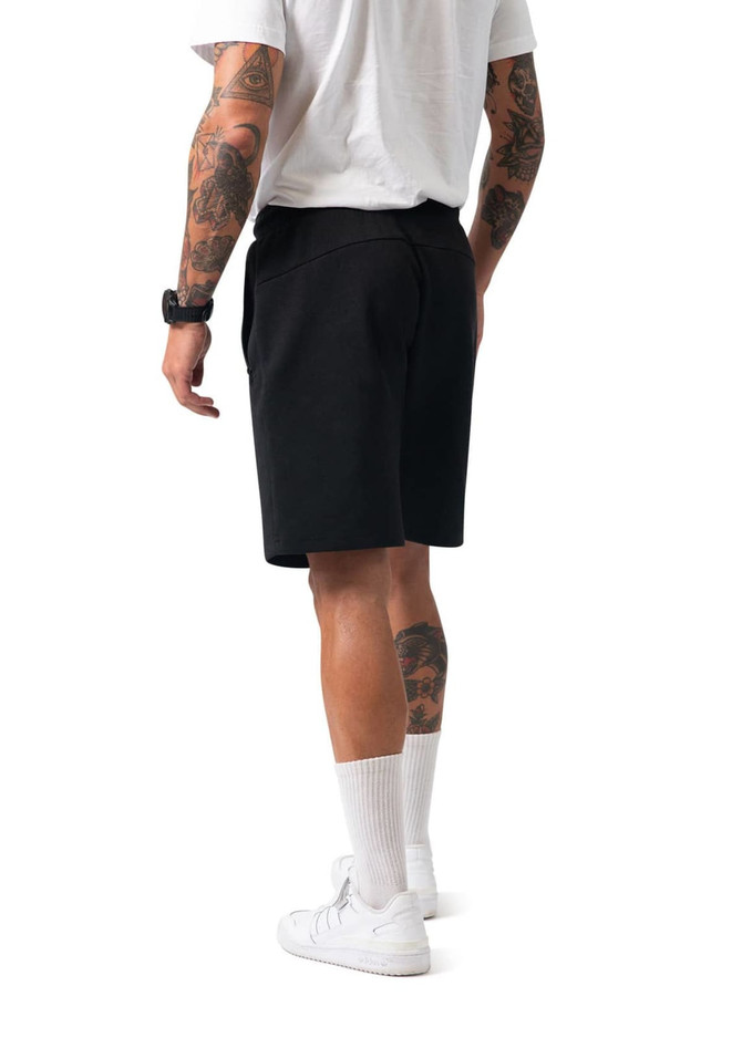 Men's cotton shorts in black, showcasing a back view with a fit design. Features a logo on the garment.
