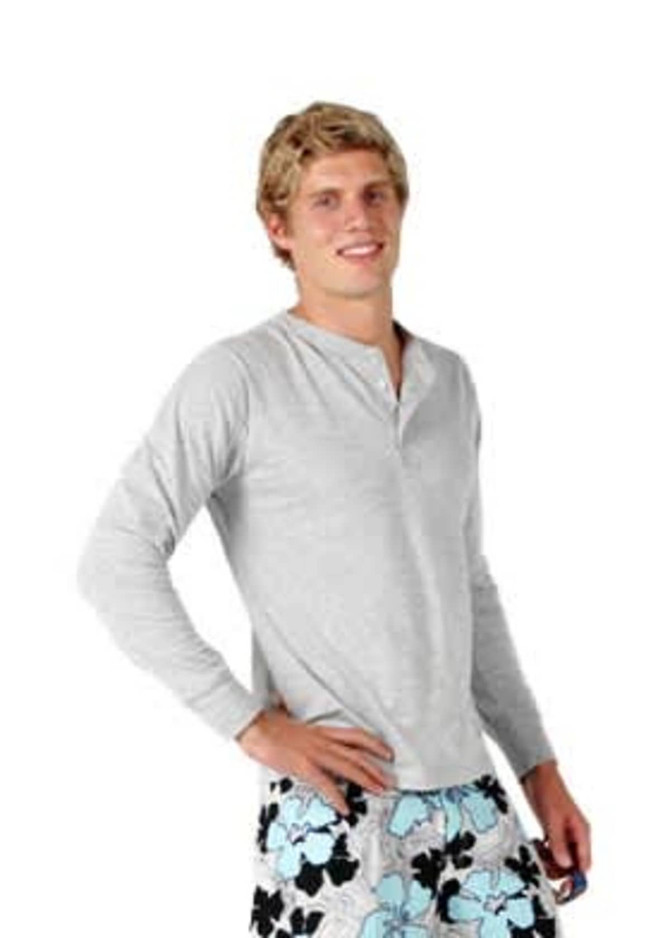 A light grey long-sleeved t-shirt worn by a model, paired with floral-patterned shorts.