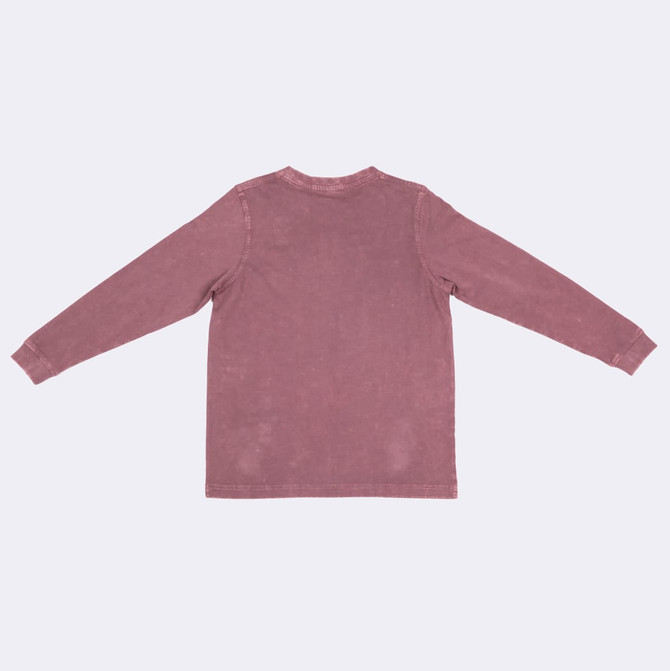 A kid's stone wash long sleeve T-shirt in a muted pink hue, featuring a simple design and a logo.