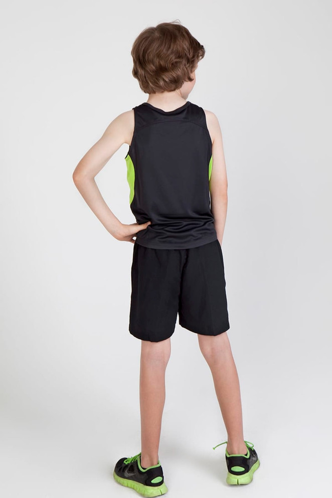 A back view of a child wearing a black and green Kids Accelerator Cool-Dry singlet and matching shorts.