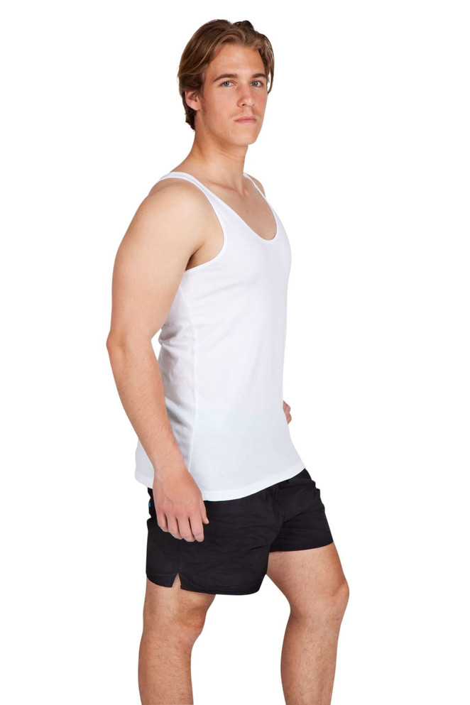 A white singlet worn by a model, paired with black shorts, featuring a logo on the garment.