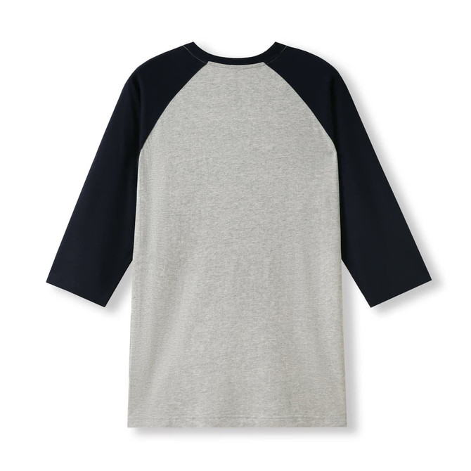 A grey unisex 3/4 sleeve raglan T-shirt featuring navy blue sleeves and a simple design. The shirt has a logo.