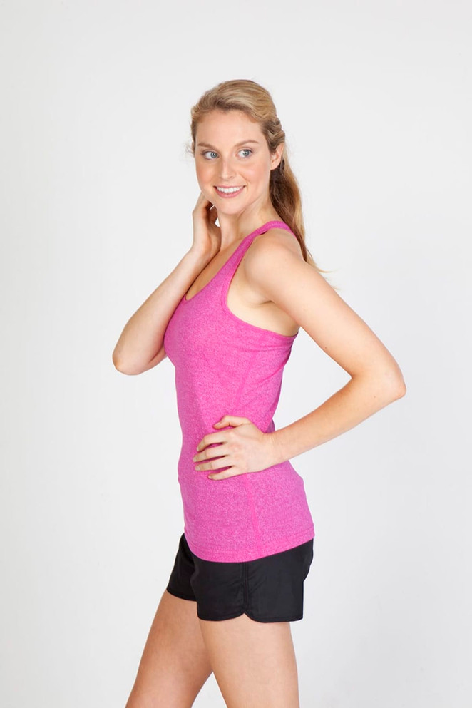 A pink athletic T-back singlet displayed on a model, paired with black shorts, showcasing a fitted style.