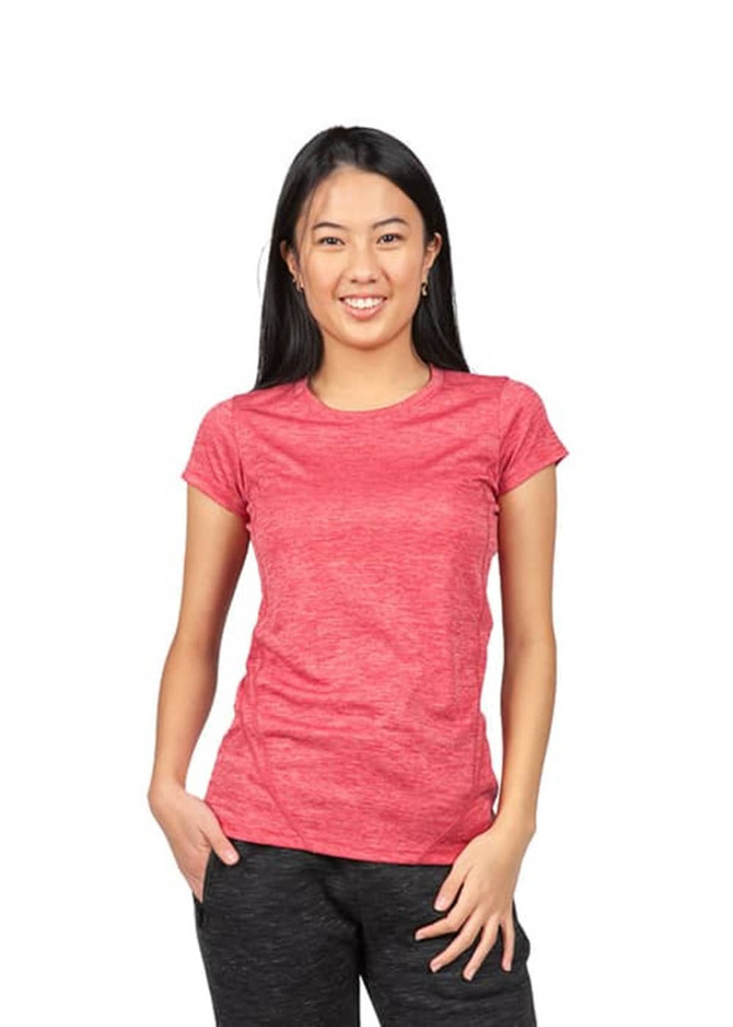 A woman models a red 100% polyester women's T-shirt featuring a logo on the chest.