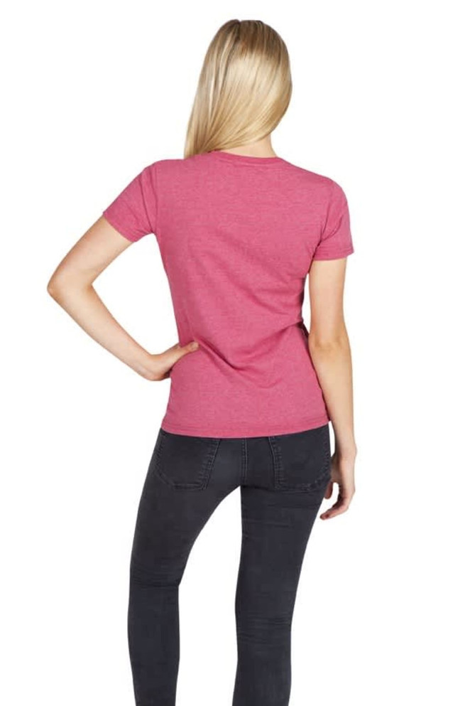 A woman wearing a pink marl T-shirt, viewed from the back, paired with dark jeans. The shirt has a logo.