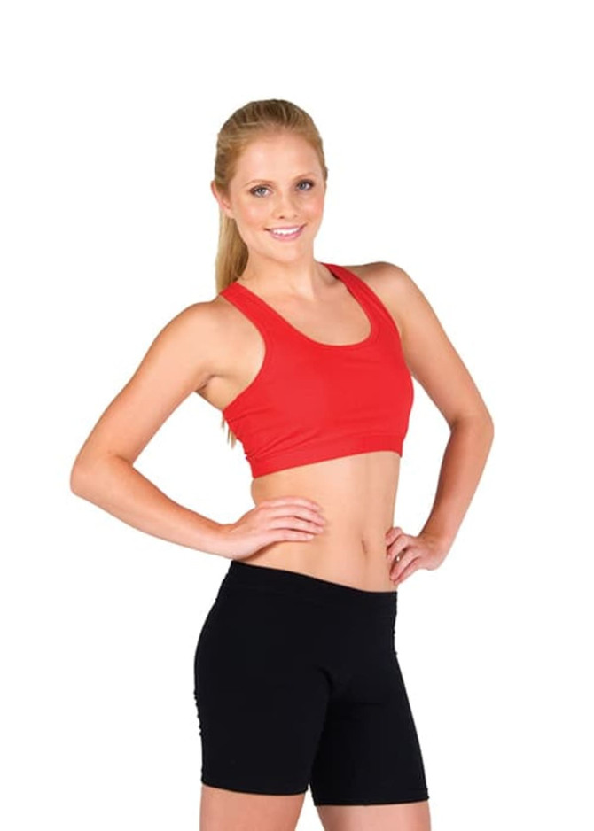 A red women's sports crop top is worn with black shorts, featured on a model with long blonde hair.